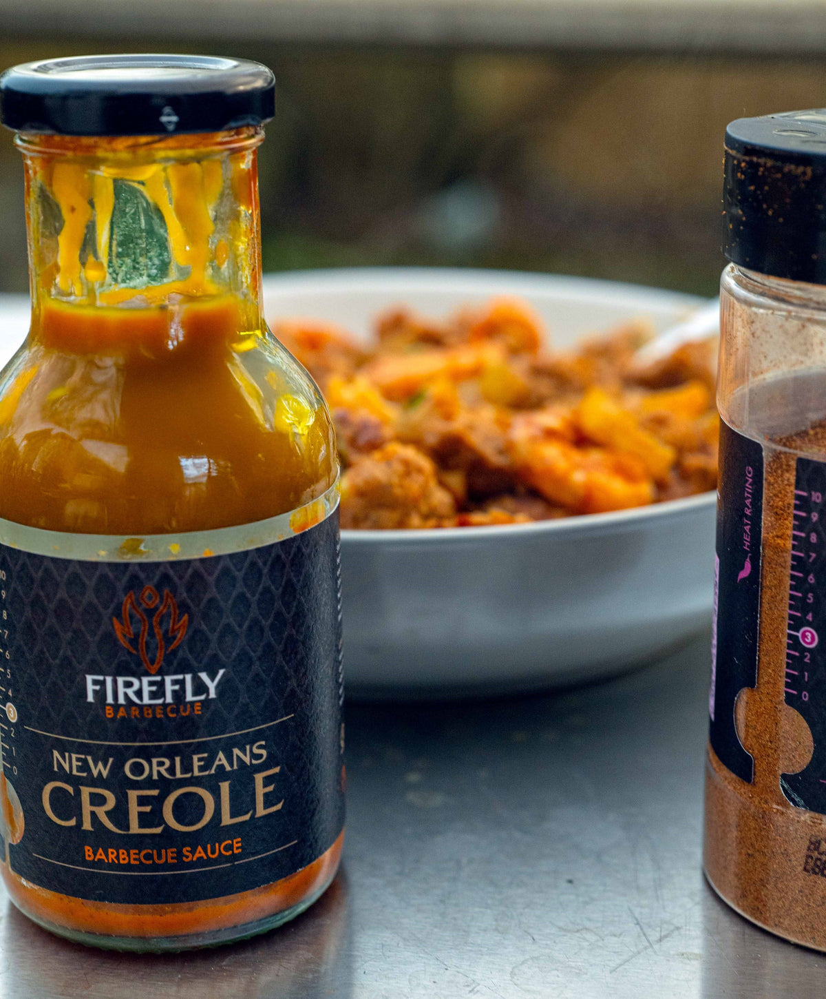 Firefly BBQ New Orleans Creole Sauce in 250ml glass bottle with black label, ideal for gumbo, jambalaya, and Creole-style dishes.